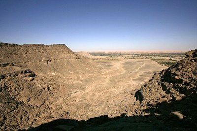 An aerial view across the circa 2500 tombs of Wadi UatUat, a large desert area between two high cliffs