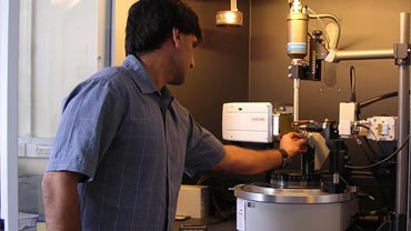 staff member using an xray crystallography machine