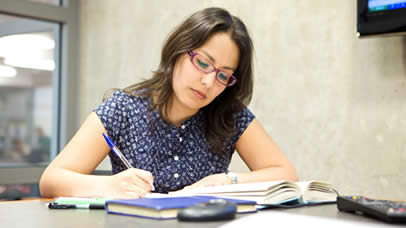 A postgraduate student studying