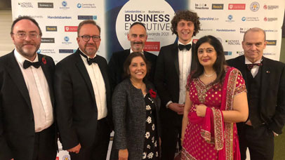 Leicester staff posing for photo at business executive awards
