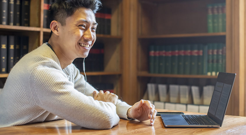 Student using a computer in the library