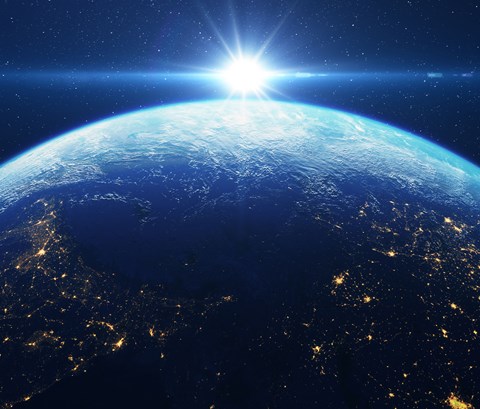 Looking over a lit up Earth from Space