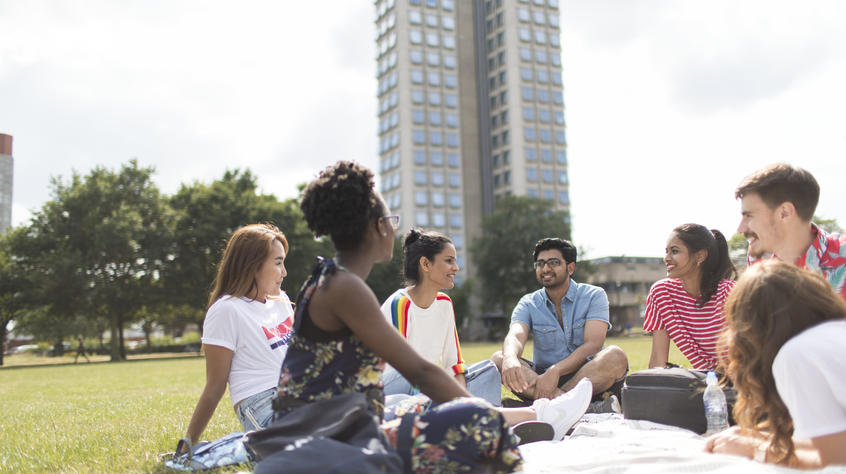 group of students sat on the grass in victoria park