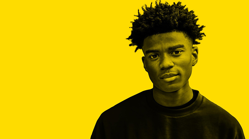 Image of young black man on a yellow background