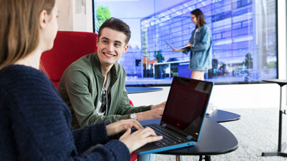 Students sat with a laptop in the Digital Reading Room in the David Wilson LIbrary