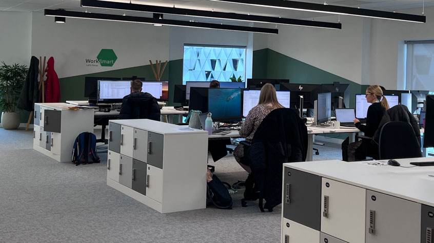 Colleagues working in an office in the Sir Bob Burgess building