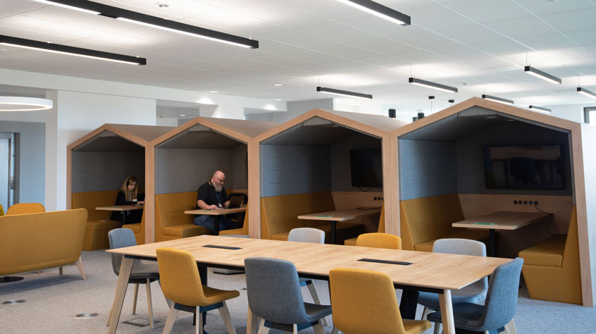 An open plan office with various styles of seating.