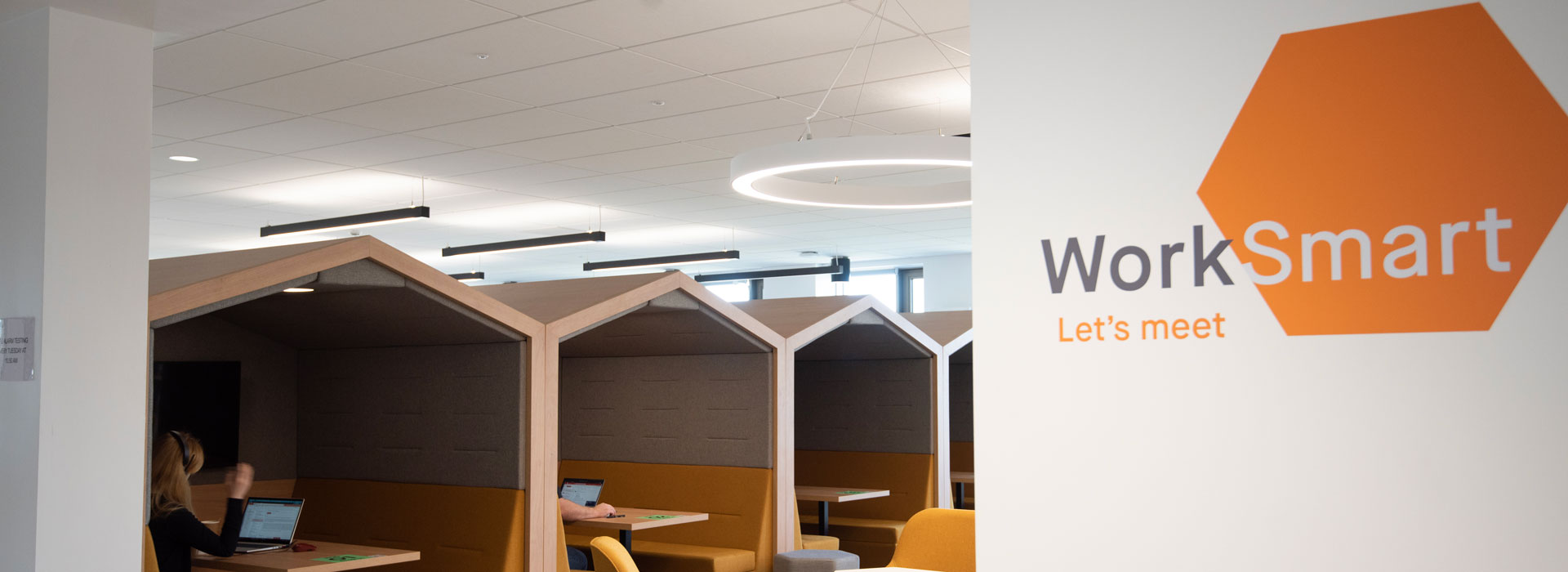 An open plan office with various styles of seating.