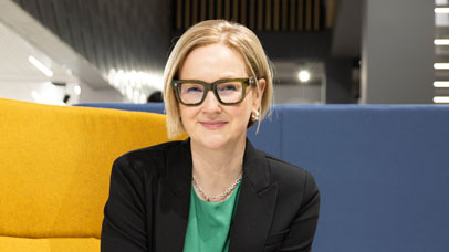 Professor Henrietta O'Connor sitting on a yellow chair
