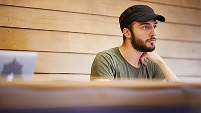 student listening in a lecture hall