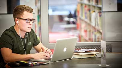 student working on a laptop