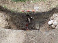 Section through the ditch of the moat, showing the position of the later stone drain, in Trench 1