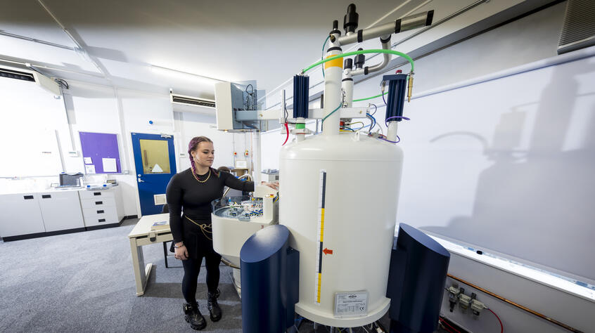 female student using an advanced NMR facility at Leicester
