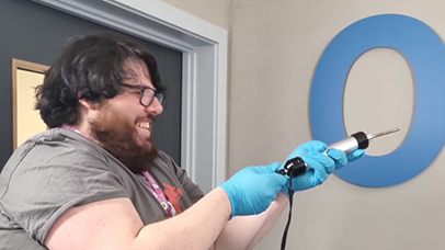 Doug Gregg sampling air using a pump inside the laboratories