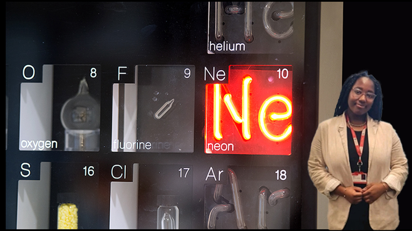 Year in Industry student, wearing professional suit, superimposed in front of the periodic table with red Neon sign.
