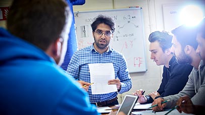 tutor teaching a small group of students