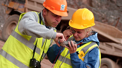 student and tutor working out in the field