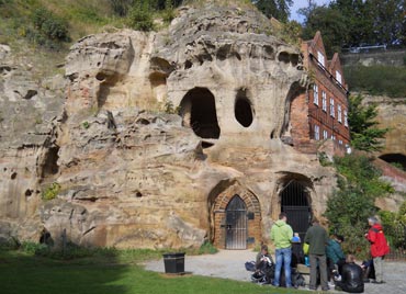 students looking at a rock outcrop in urban nottingham