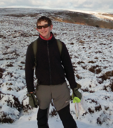 tom doing fieldwork on top of a snowy mountain