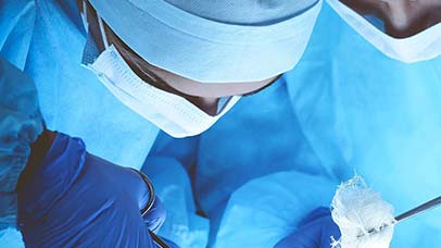 surgeons working in operating theatre