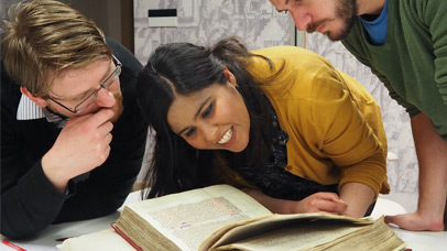 University of Leicester students examining a medieval manuscript