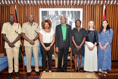 The project team meeting President Granger, 30 October 2019. Group of seven people standing and posing for a photograph.