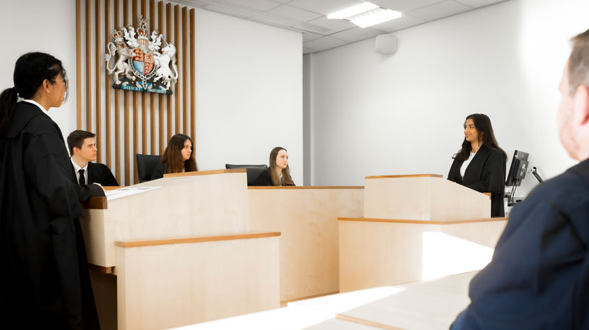 Students participating in a mock court set up