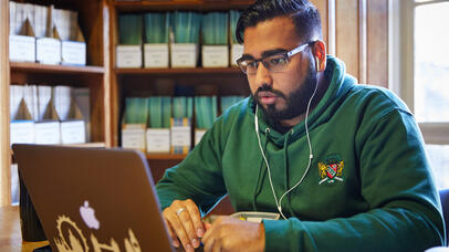 Student studying in Harry Peach library