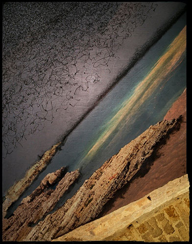 Photographic artwork based on coastal seascape featuring jagged rocks, deep and dark colour contrast between ocean, beach, rocks and stone wall