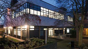 museum studies building at night