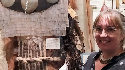 Severine with her favourite object on display at the Pitt Rivers Museum