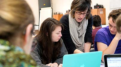 tutor with a small group of students in class