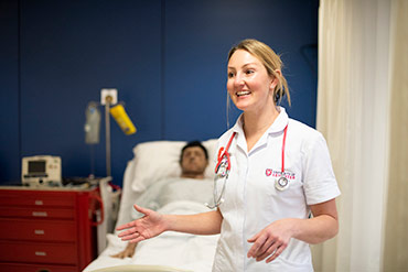 Student nurse treating a patient