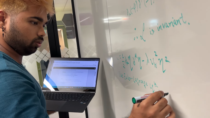 Avi solving a physics problem