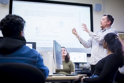 One of our staff explaining physics