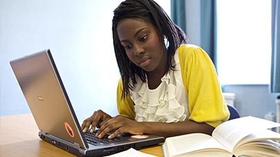 student working on a laptop
