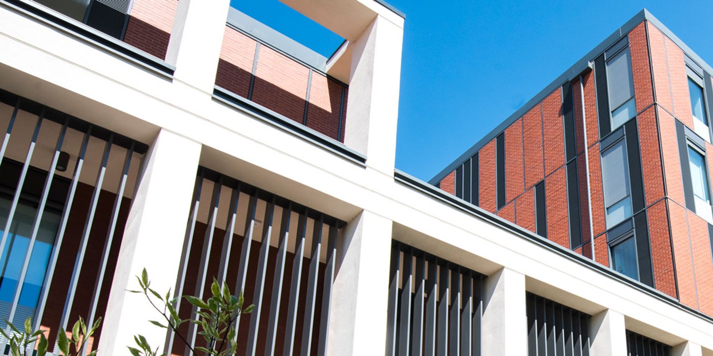 The exterior of the George Davies Centre on Leicester campus on a bright sunny day.