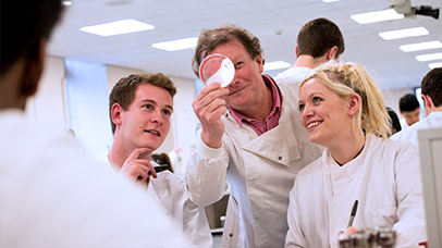 students and a tutor in class together