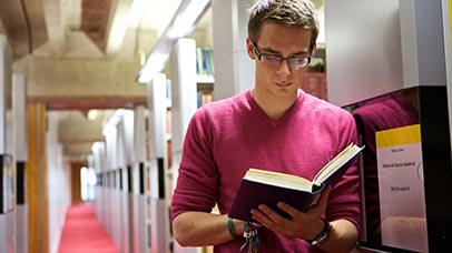 student reading in the library