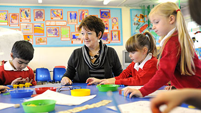 teacher in class with children