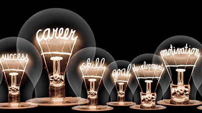 lightbulbs with inspirational words aligned to careers lit up