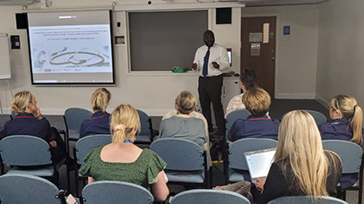 Nurses listening to an academic talking about the research project