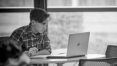 student working on a laptop