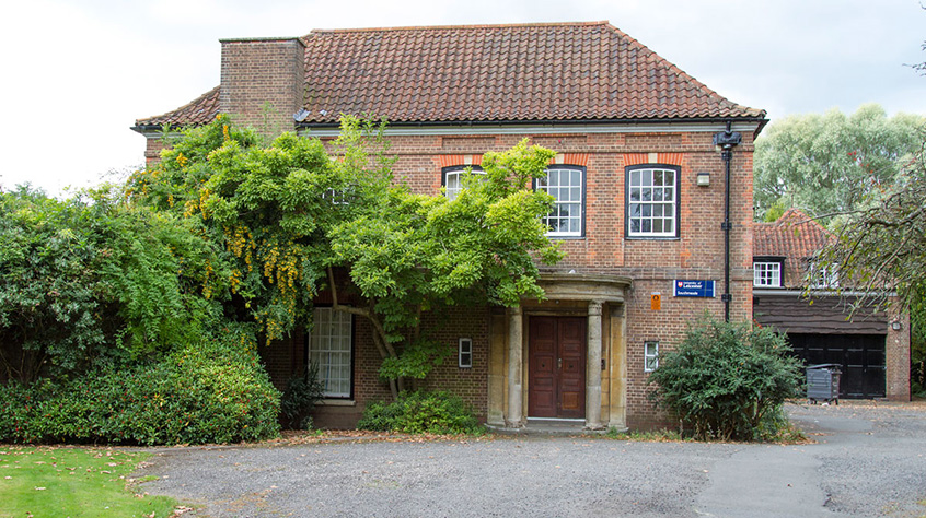 An external photo of the front of Southmeade House in The Village.