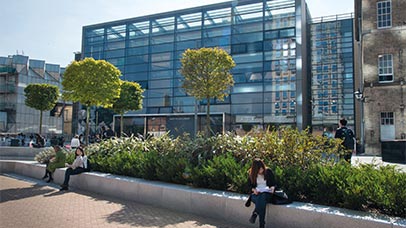 view of david wilson library with students sat outside