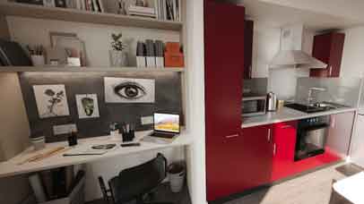 Desk and kitchen area in Freemens