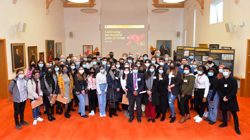 Participants gather for group photo at Centenary Scholars reception.