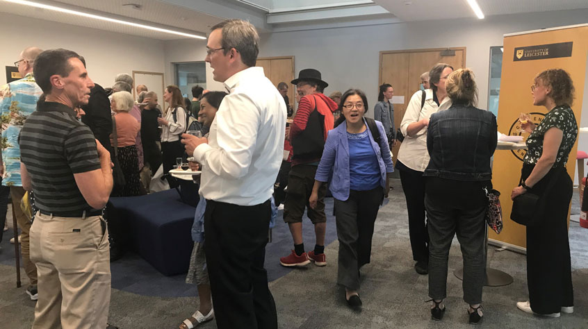 Guests enjoy carrying on the discussion after the Q&A