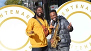 4/10/21 - The 2 members of Poetry in Motion, one in a yellow shirt and one holding a saxophone, join us for our centenary celebrations