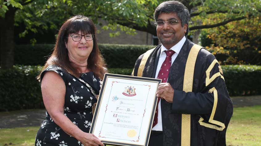 Nishan with the Mayor of Oadby and Wigston.